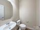 Half bathroom with pedestal sink and white toilet at 621 Ravenglass Dr, Fort Mill, SC 29715