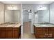 Dual vanity sinks and granite countertops provide a luxurious feel at 621 Ravenglass Dr, Fort Mill, SC 29715