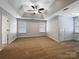 Spacious bedroom features ample natural light and neutral carpet at 621 Ravenglass Dr, Fort Mill, SC 29715