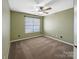 Bedroom with neutral carpet, window, and ceiling fan at 621 Ravenglass Dr, Fort Mill, SC 29715