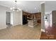 Open concept kitchen with granite countertops, stainless steel appliances, and a spacious center island at 621 Ravenglass Dr, Fort Mill, SC 29715
