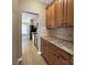 Galley kitchen with granite countertops, tiled backsplash, and stainless steel appliances at 621 Ravenglass Dr, Fort Mill, SC 29715