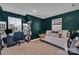 Study with a daybed, large windows, and a built-in bookshelf at 6278 Ashton Park Dr, Denver, NC 28037