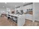 Stylish kitchen with a large island and seating, stainless steel appliances, and modern finishes at 6278 Ashton Park Dr, Denver, NC 28037