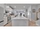 Modern kitchen boasts a large island, stainless steel appliances, and an open layout at 6278 Ashton Park Dr, Denver, NC 28037