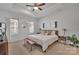 Serene main bedroom featuring a tray ceiling, natural light, and neutral decor at 6278 Ashton Park Dr, Denver, NC 28037