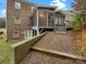 Exterior view of screened porch and walkout basement at 705 Old Cove Rd, Tega Cay, SC 29708