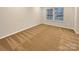 Neutral bedroom with natural light and carpeted floors at 705 Old Cove Rd, Tega Cay, SC 29708