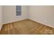 Neutral bedroom with natural light and carpeted floors at 705 Old Cove Rd, Tega Cay, SC 29708