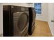 Laundry area features front loading washer and dryer, plus shelving at 705 Old Cove Rd, Tega Cay, SC 29708