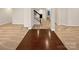Spacious open-plan living area with hardwood floors and a staircase at 705 Old Cove Rd, Tega Cay, SC 29708
