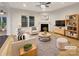 Bright living room with fireplace, plush seating, and modern decor for a cozy and inviting atmosphere at 705 Old Cove Rd, Tega Cay, SC 29708