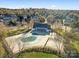 Aerial view of clubhouse featuring tennis courts and a pool in a residential community at 806 Irish Green Dr, Clover, SC 29710