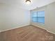 Cozy bedroom featuring neutral walls, carpet flooring, and a window with natural light at 8619 Harris Lake Ln, Charlotte, NC 28269