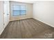 Carpeted bedroom with a window for natural light and a closet for storage at 8619 Harris Lake Ln, Charlotte, NC 28269