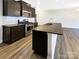Modern kitchen with granite countertops, stainless steel appliances, and a central island at 8619 Harris Lake Ln, Charlotte, NC 28269