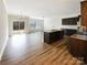 Open-concept living space featuring a kitchen with island and access to the backyard via sliding door at 8619 Harris Lake Ln, Charlotte, NC 28269