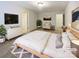 Well-lit primary bedroom featuring a neutral palette, a large bed, and ample closet space at 8619 Harris Lake Ln, Charlotte, NC 28269