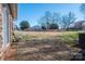 Wide shot of brick patio and expansive backyard offering plenty of outdoor space at 9026 Longview Dr, Charlotte, NC 28214