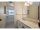 Well-lit bathroom with tile floors, and a granite countertop sink at 9026 Longview Dr, Charlotte, NC 28214