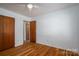 Bedroom with wood floors, and natural light at 9026 Longview Dr, Charlotte, NC 28214