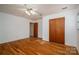 Cozy bedroom with hardwood floors and natural light; features a spacious closet for storage at 9026 Longview Dr, Charlotte, NC 28214