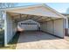 Spacious carport with a garage in the rear offering protection and convenience at 9026 Longview Dr, Charlotte, NC 28214