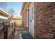 Inviting brick home entrance with charming details, complemented by a convenient wooden ramp at 9026 Longview Dr, Charlotte, NC 28214