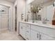 Bright bathroom featuring a double vanity with white cabinets and ample counter space at 912 Smithcliffs Trl, York, SC 29745