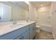 Bright bathroom featuring a double vanity, tile flooring, and combination tub and shower at 912 Smithcliffs Trl, York, SC 29745