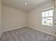 Simple bedroom with a large window providing plenty of natural light at 912 Smithcliffs Trl, York, SC 29745