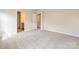 Bright and spacious bedroom with neutral paint and carpet and an ensuite bathroom at 912 Smithcliffs Trl, York, SC 29745