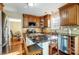 The Kitchen features an island with granite countertops and a stainless steel dishwasher at 9220 Torrence Crossing Dr, Huntersville, NC 28078