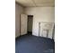 Bedroom with carpet and fireplace with white mantel at 104 Baldwin Ave, Spencer, NC 28159