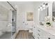 Modern bathroom with a marble walk-in shower, double vanity, and elegant fixtures at 108 Pebble Creek Xing, Fort Mill, SC 29715