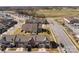 Aerial view of a real estate neighborhood, showcasing townhomes with a community park at 11142 Jc Murray Nw Dr, Concord, NC 28027