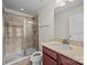 Bathroom featuring tiled shower, granite vanity, and modern lighting at 11142 Jc Murray Nw Dr, Concord, NC 28027