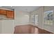 Bright dining area with hardwood floors, pendant lighting, and a glass door leading to the outdoors at 11142 Jc Murray Nw Dr, Concord, NC 28027