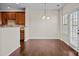 Eat in kitchen features stainless appliances, hardwood floors, and natural light at 11142 Jc Murray Nw Dr, Concord, NC 28027