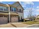 Charming townhome with a two-car garage and classic architectural details at 11142 Jc Murray Nw Dr, Concord, NC 28027