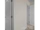 Hallway with white doors and neutral walls, creating a seamless flow at 11142 Jc Murray Nw Dr, Concord, NC 28027