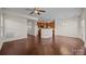 Open concept living room features hardwood floors, a ceiling fan, and recessed lighting throughout at 11142 Jc Murray Nw Dr, Concord, NC 28027