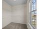 Walk-in closet featuring shelving units and a window with a view at 11142 Jc Murray Nw Dr, Concord, NC 28027