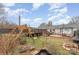 Landscaped backyard offers an outdoor play structure at 127 Wright Cir, Cherryville, NC 28021