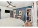 This bright bedroom boasts a ceiling fan, walk-in closet, and stylish gray dresser with mirror at 127 Wright Cir, Cherryville, NC 28021