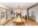 Bright dining room featuring a chandelier and access to the outdoors at 127 Wright Cir, Cherryville, NC 28021