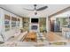 Bright living room with fireplace, built-in shelving, and stylish ceiling fan at 127 Wright Cir, Cherryville, NC 28021