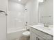 Clean white bathroom with a tub-shower combo, vanity with sink, and modern fixtures at 13134 Macon Hall Dr, Mint Hill, NC 28227