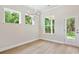 Dining area with natural light, chandelier, and access to the patio at 13134 Macon Hall Dr, Mint Hill, NC 28227