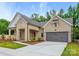 Charming single-story brick home with a two-car garage and well-manicured lawn at 13134 Macon Hall Dr, Mint Hill, NC 28227